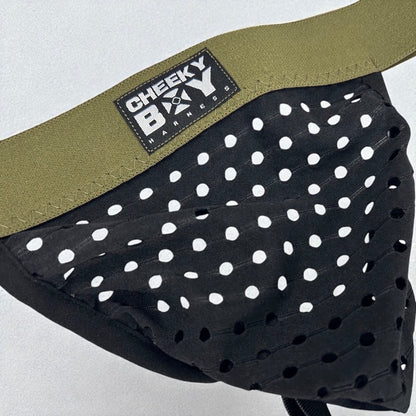 Men’s black mesh jockstrap with army green elastic waistband, featuring a Cheeky Boy Harness brand logo at the centre. Close up shot showing mesh holes clearly. 