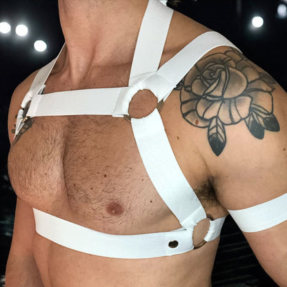 Man Wearing a Made-To-Measure White Elastic Body Harness with Metal Rings and Matching Bicep Bands, Club Background, Custom Fit Design