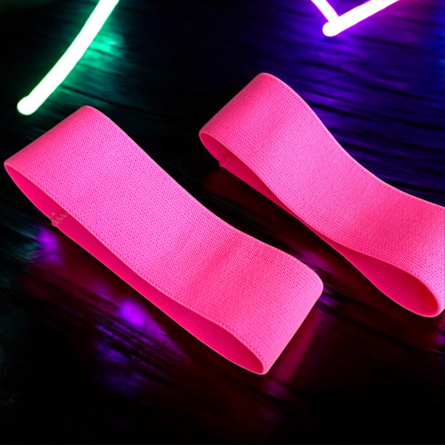A pair of Neon Pink Bicep Bands