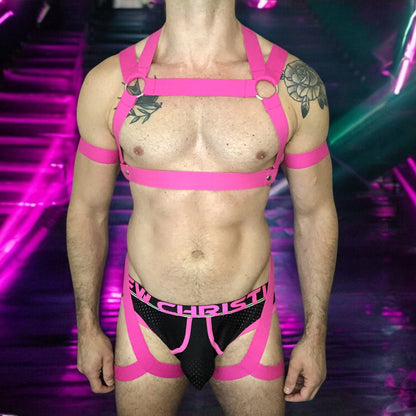 Man Wearing a Made-To-Measure Hot Pink Elastic Body Harness with Metal Rings and Matching Bicep Bands by Cheeky Boy Harness