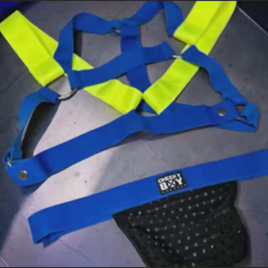 royal blue and neon yellow chest harness set showing elastic straps, metal rings, removable popper strap, bicep bands and optional black mesh jockstrap video
